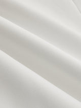 White V-neck top fabric texture, close-up