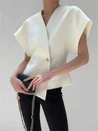 White V-neck top with gold button detail, front view