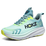 Scarpa da corsa sportiva verde acqua e gialla con suola bianca, logo laterale, design moderno e traspirante, ideale per attività sportive e fitness.