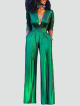 Sage – Skinnende aftenjumpsuit med vide ben og V-hals